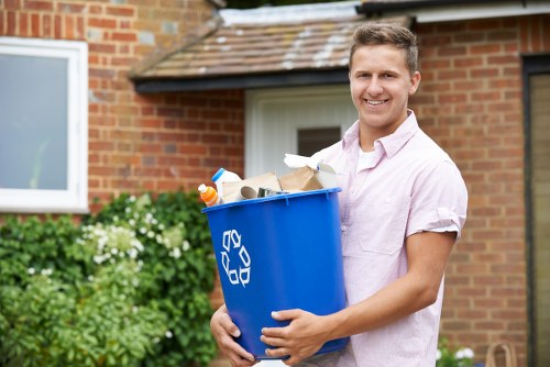 Professional gardeners pruning and trimming plants in Penge